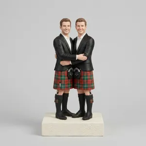 Custom wedding cake topper of two people in Scottish kilts.