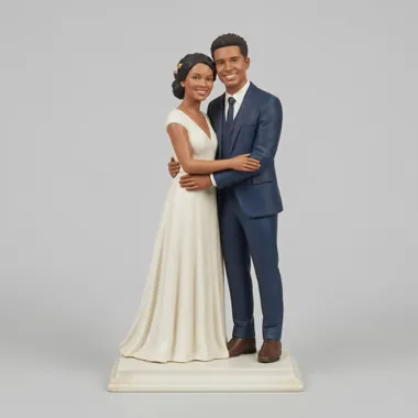 Custom wedding cake topper of two people in a western wedding dress and suit.