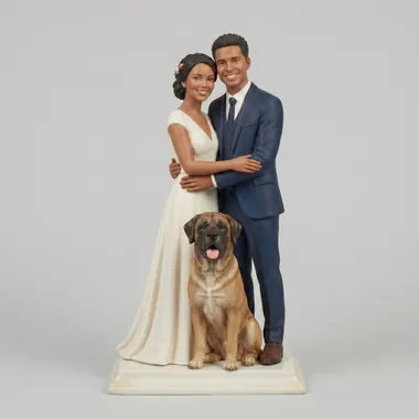 Custom wedding cake topper of two people with their large dog.