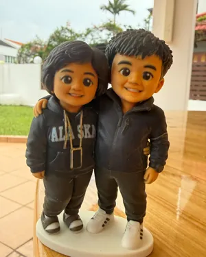 A real photo of Nicole's printed figure of her parents